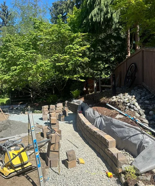 Installation of natural Grass, Retaining wall construction & Fire Pit in Lake Stevens 
